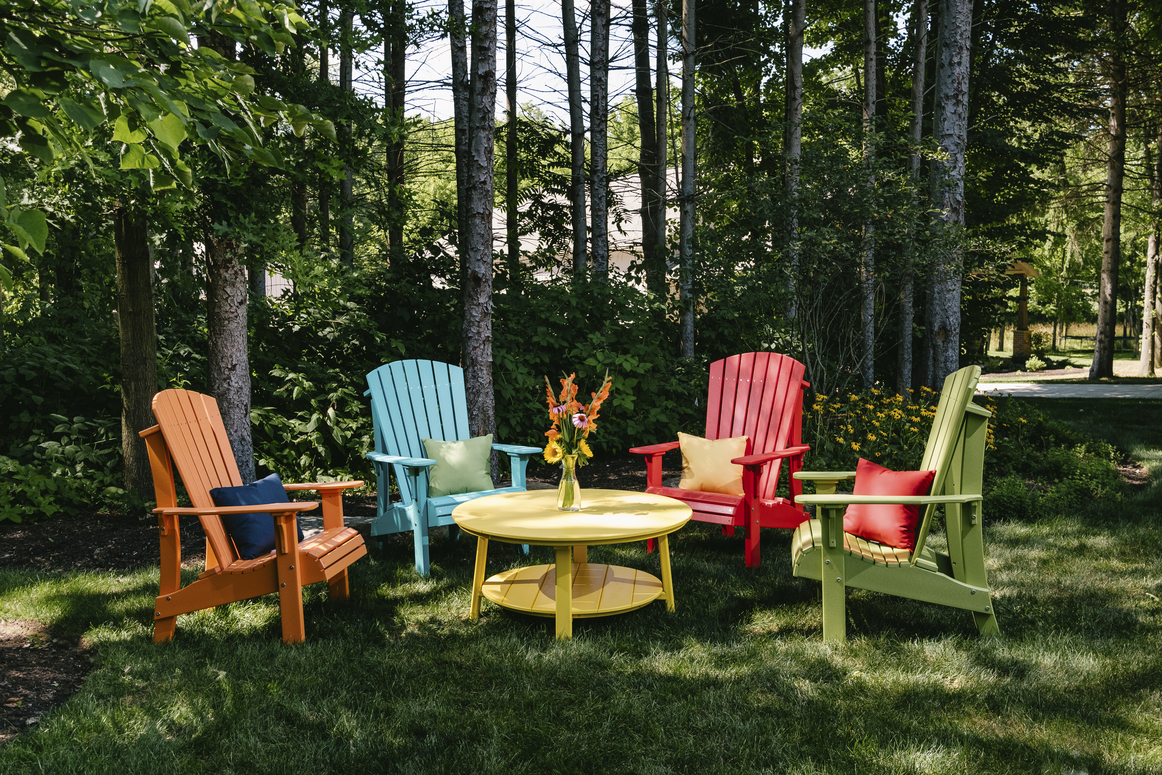 Royal Adirondack chairs in bright colors around a patio setting